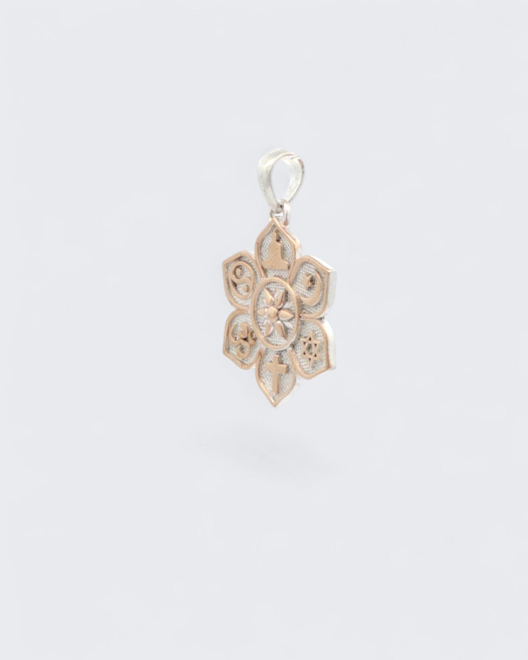 Coexist Harmony Lotus Pendant side profile view showing the 3D depth and raised bronze border detail of the lotus petal shape