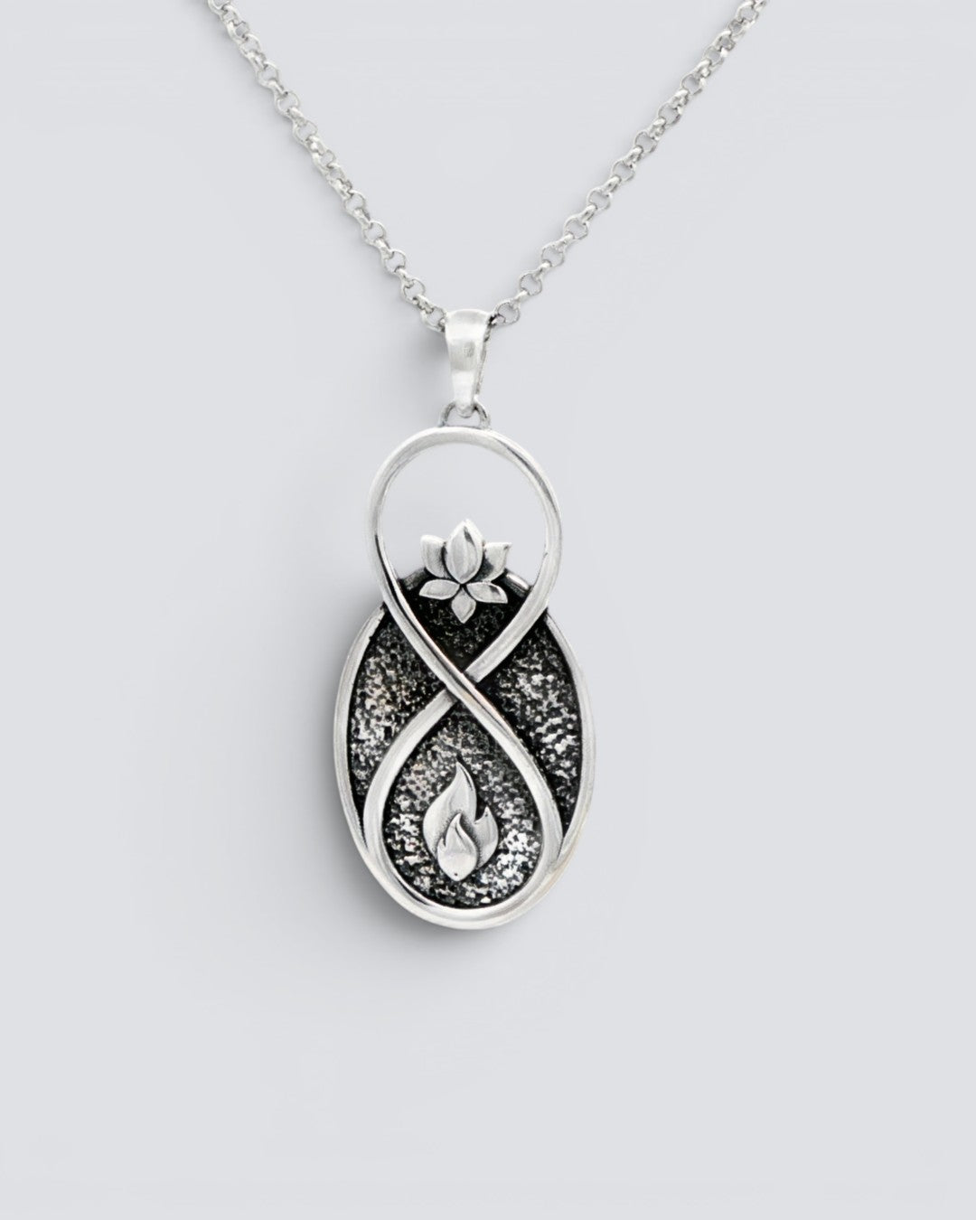 Infinite Lotus Flame Pendant silver-plated charm hanging on a silver rolo chain, full pendant and chain visible against light grey background