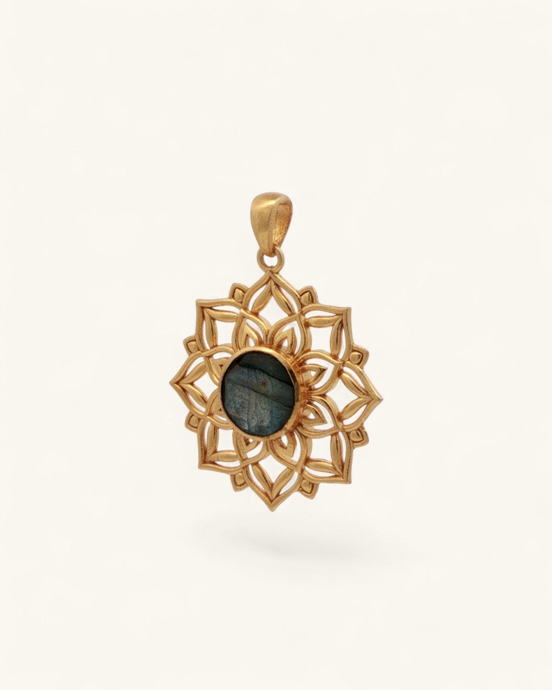 Three-quarter angle view of gold lotus mandala labradorite pendant showing open filigree petal detail