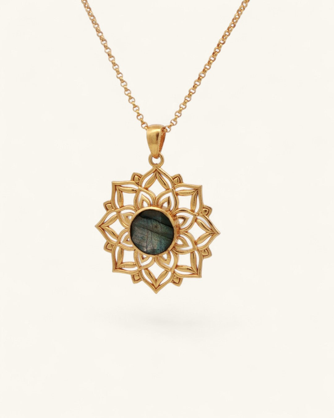 Gold lotus mandala pendant with labradorite gemstone hanging on a gold rolo chain against a white background