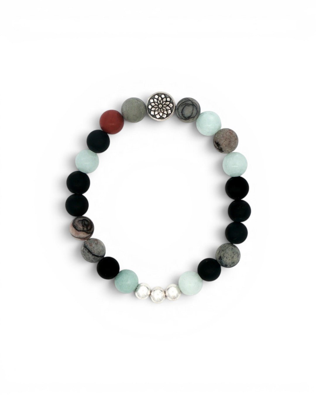 Mandala gemstone stretch bracelet laid flat, showing chalcedony, onyx, red jasper beads and silver mandala charm