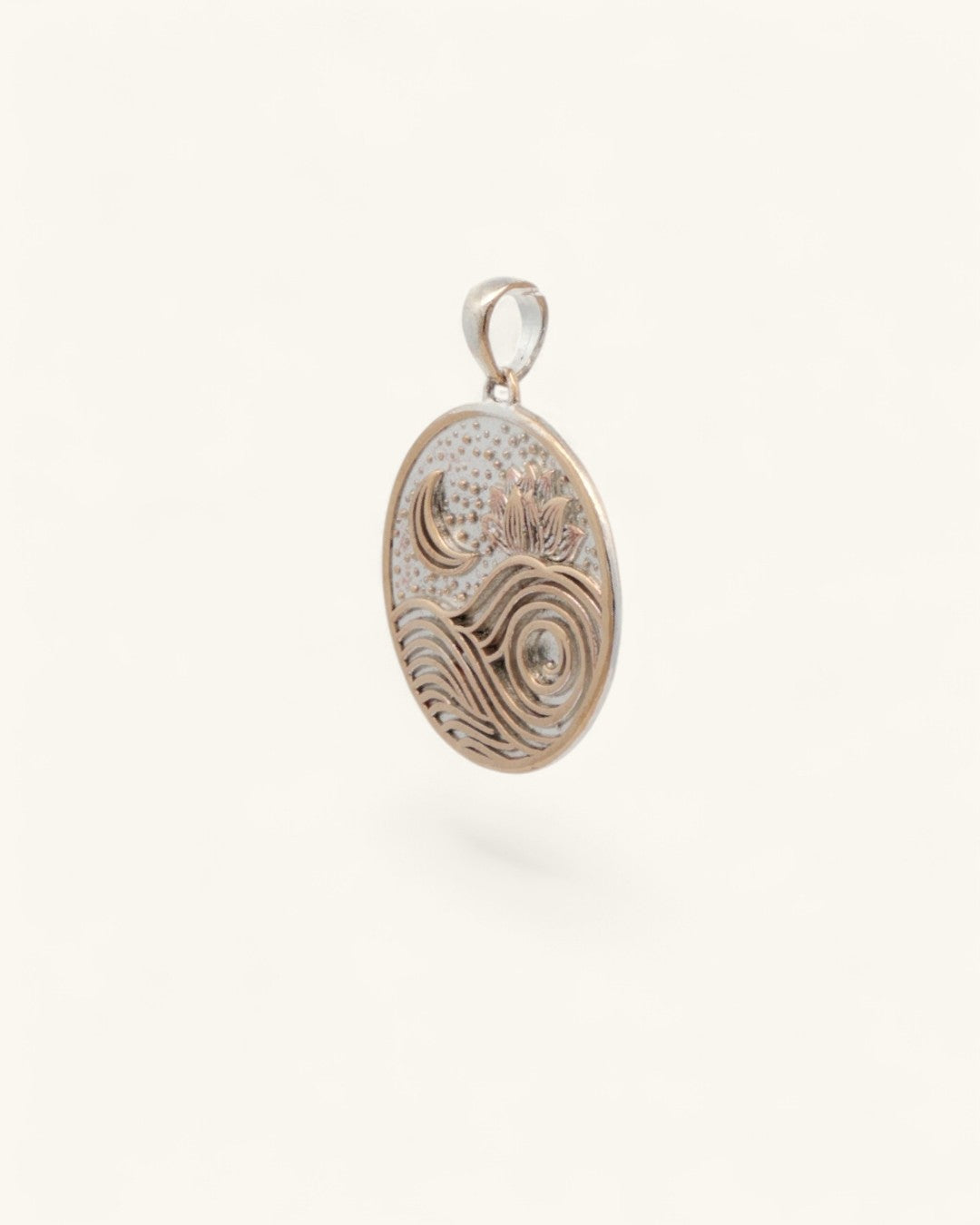 Silver-plated bronze moon wave lotus pendant viewed from the left side, showing engraved wave and lotus design