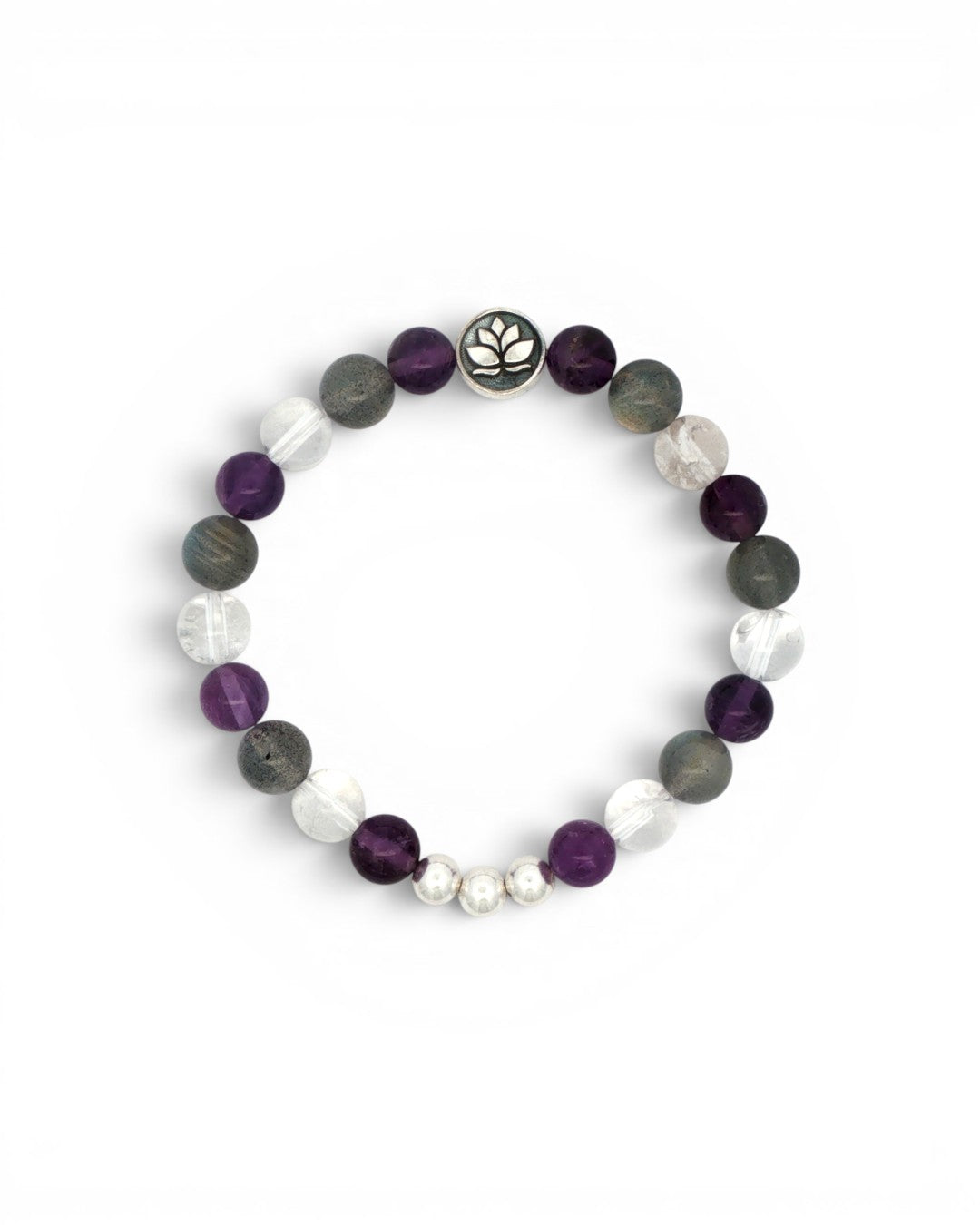 Amethyst, labradorite, and clear quartz lotus stretch bracelet laid flat on white background, top-down view