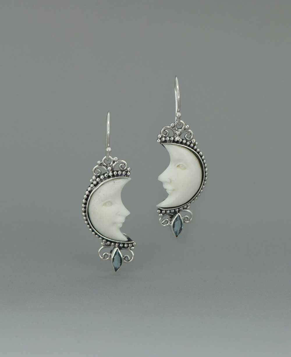 Bali - Crafted Sterling Silver Earrings with Carved Moon Face and Blue Topaz - Earrings