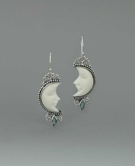 Bali - Crafted Sterling Silver Earrings with Carved Moon Face and Blue Topaz - Earrings