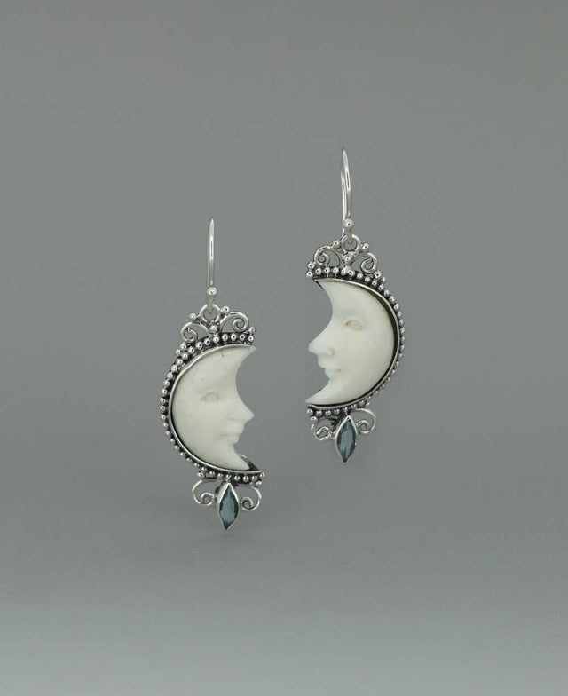 Bali - Crafted Sterling Silver Earrings with Carved Moon Face and Blue Topaz - Earrings