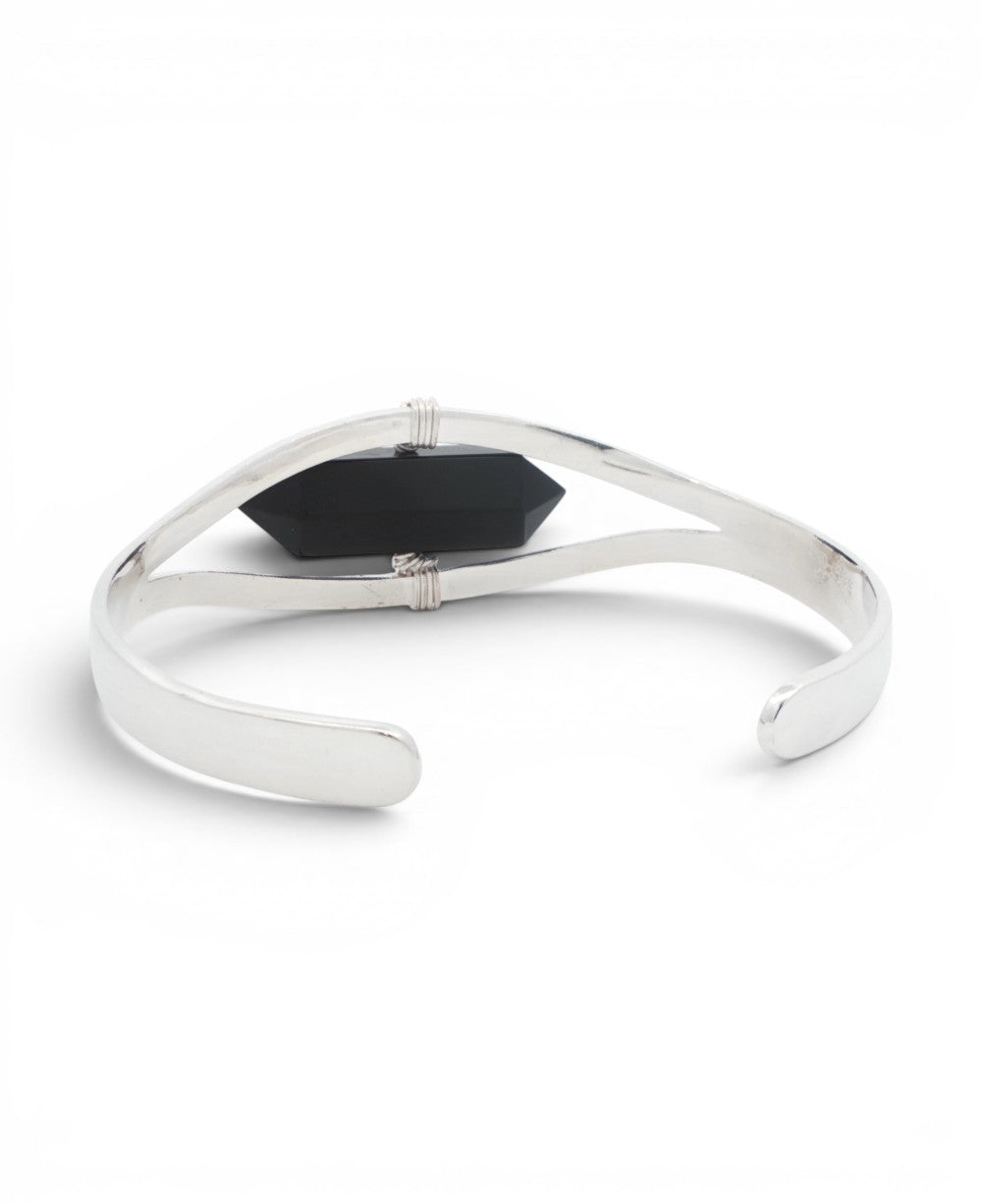 Top view of silver black onyx cuff bracelet showing the open adjustable design with tapered ends