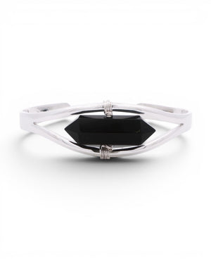 Black onyx crystal point set in a minimalist silver cuff bracelet, front view with wire-wrapped bindings