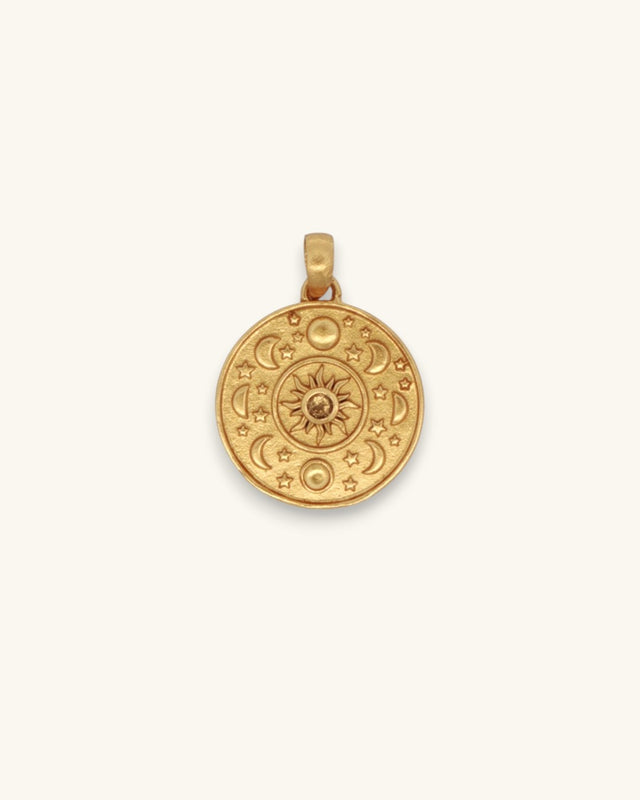Celestial Sun and Moon Citrine Pendant in gold-plated brass, front view showing engraved sun, moon phases, and stars