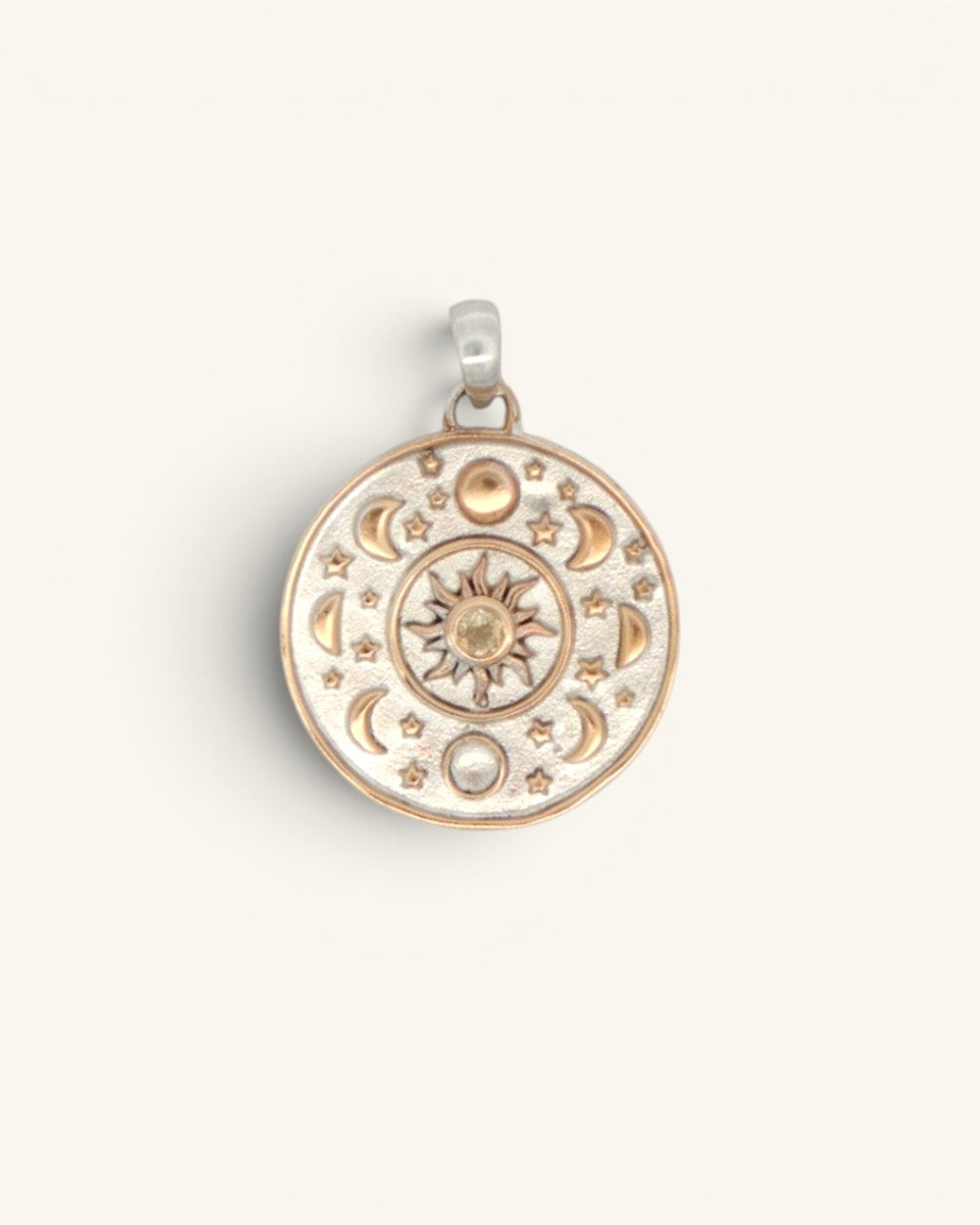 Celestial Sun Moon Phases Pendant front view showing bronze sun with citrine center, moon phase ring, and silver-plated disc