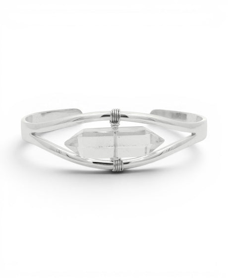Detail of clear quartz crystal point bracelet with wire-wrapped silver bindings holding the double-terminated stone