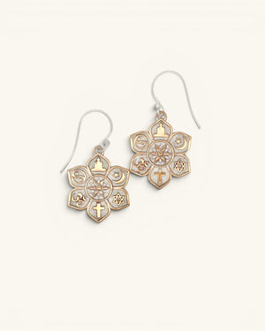 Coexist Harmony Earrings pair at an angle on white background, gold interfaith symbols and textured silver mandala clearly visible