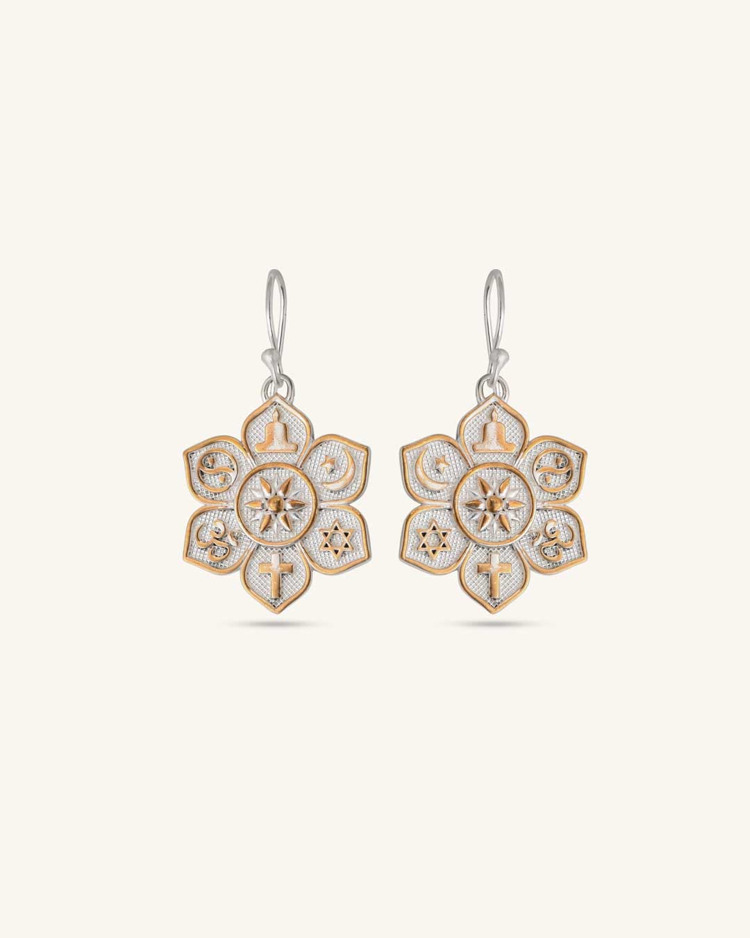Coexist Harmony Earrings pair with gold-tone interfaith symbols on textured silver lotus mandala, front view on white background