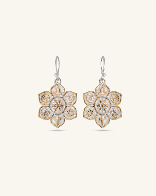 Coexist Harmony Earrings pair with gold-tone interfaith symbols on textured silver lotus mandala, front view on white background