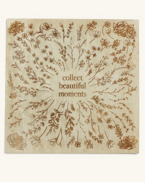 Collect Beautiful Moments wood wall sign front view showing engraved botanical florals radiating outward from center text