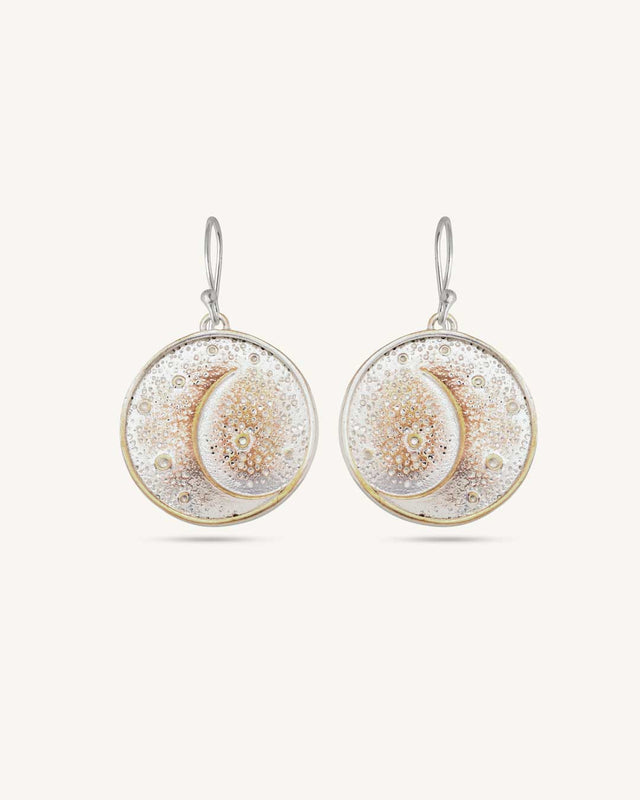 Crescent moon disc earrings in silver-plated bronze, front view of pair against white background showing textured dot detailing