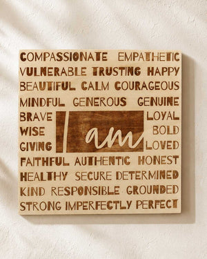 I Am laser-engraved wood wall hanging front view showing all affirmation words on a light birch wood panel