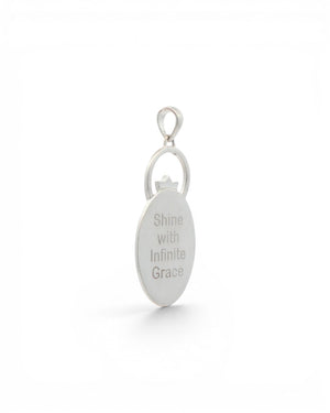 Back of Infinite Lotus & Flame Pendant showing smooth silver oval engraved with the text Shine with Infinite Grace