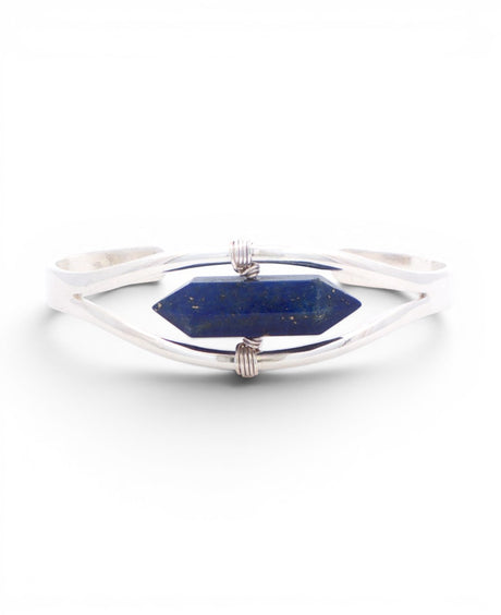 Lapis lazuli crystal point set in a silver cuff bracelet, front view with wire-wrapped bindings