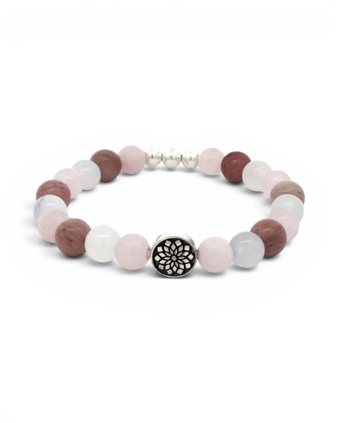 Mandala gemstone stretch bracelet angled view on white, engraved silver mandala charm bead facing forward among rose quartz and rhodochrosite beads