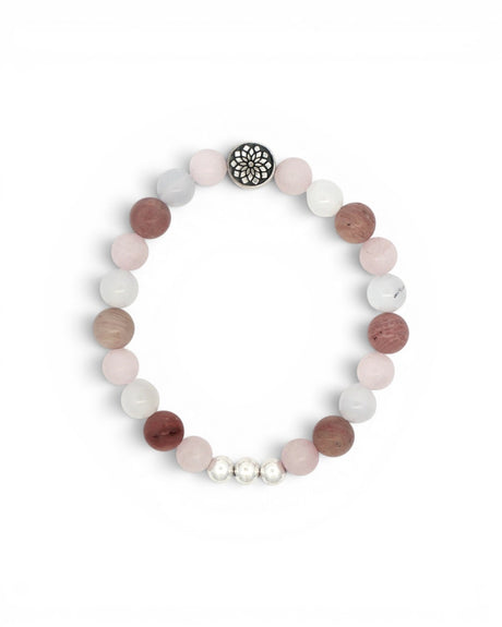 Mandala gemstone stretch bracelet flat lay on white, showing rose quartz, rhodochrosite, and chalcedony beads with silver mandala charm