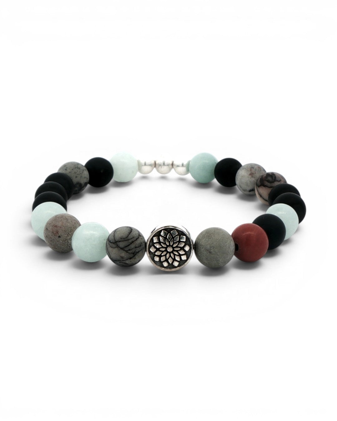 Mandala gemstone stretch bracelet front view with silver mandala charm centered between chalcedony and red jasper beads