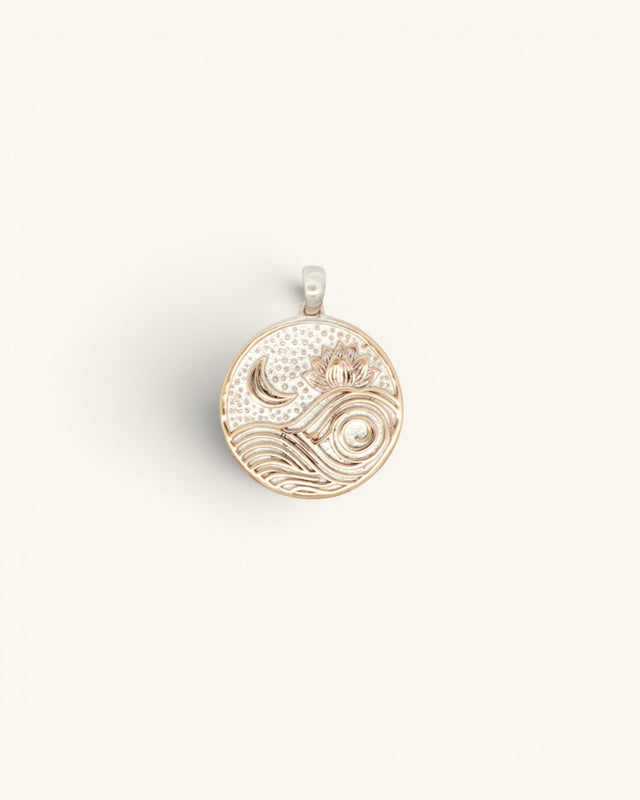 Round silver-plated bronze moon and wave lotus pendant, flat overhead view showing engraved celestial design