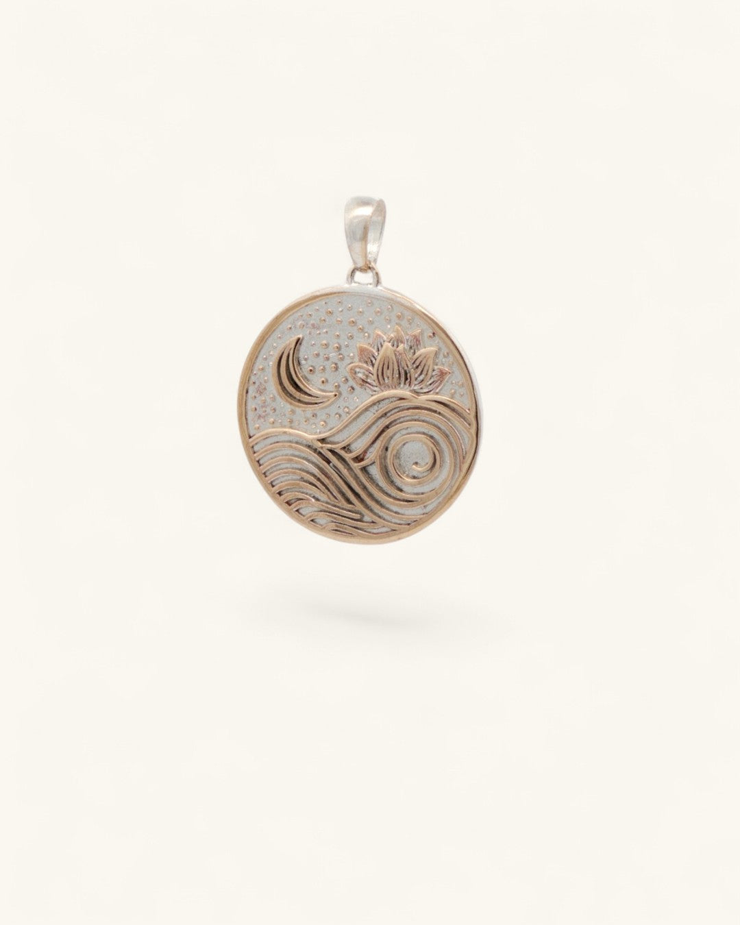 Moon and wave lotus bronze pendant, slightly angled front view showing crescent moon, lotus, and wave engraving