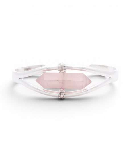 Rose quartz crystal point set in a minimalist silver cuff bracelet, front view with wire-wrapped bindings