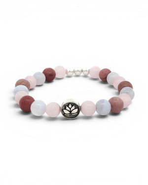 Love Connection Lotus Bracelet on white background, rotated angle with silver lotus charm at front-center and spacer beads positioned at top