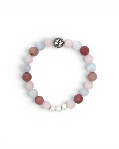 Love Connection Lotus Bracelet flat lay on white, rose quartz, rhodochrosite, and blue-grey beads with silver lotus charm, top view