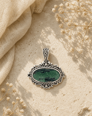 Sterling Silver Ruby Zoisite Pendant — charms & pendants, editorial travertine lifestyle photo