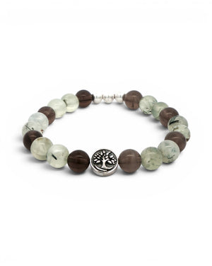 Angled view of Tree of Life bracelet with silver tree charm centered at front, flanked by smoky quartz and prehnite gemstone beads